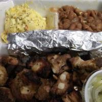 Rib Tips Plate · Pork rib tips served with bread, pickles, onions, mild sauce, potato salad, pinto beans, or ...