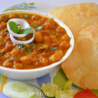13. Poori Bhaji · Chick peas cooked with onion served with poori bread.