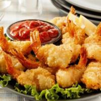 3. Shrimp Pakora · Deep fried shrimp served with onion ring.