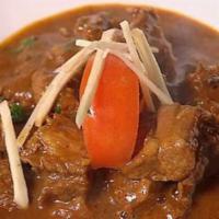 8. Meat Curry · Cooked with onions, fresh tomato with curry sauce. Served with basmati rice.