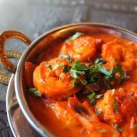 6. Shrimp Vindaloo · Shrimp cooked with potato and hot spices. Served with basmati rice.