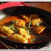 1. Tilapia Fish Curry · Cooked with curry sauce. Served with basmati rice.