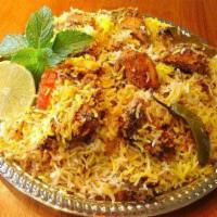 6. Chicken Biryani · Marinated chicken cooked with basmati rice, almond and raisins.