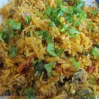 10. Shrimp Biryani · Marinated shrimp, herb and spices cooked with basmati rice.