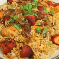 9. Special Mixed Meat Biryani · Lamb, chicken and vegetable, herb and spices cooked with basmati rice.