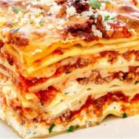 Lasagna · Layered love!   Our made from scratch made Bolognese beef and pork meat sauce, besciamella, ...