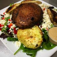 Ciao Bella Platter Salad · Organic grilled tofu, grilled portabella mushroom, avocado, tomatoes and red cabbage on a be...