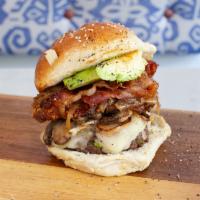 2. The VIP Burger · Beef, breaded chicken breast, bacon, caramelized onions, grilled mushrooms, avocado and mozz...