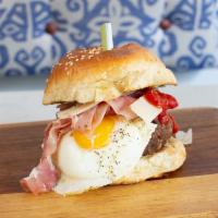 15. Iberica Burger · Beef, prosciutto, Parmesan cheese and two eggs sunny side up.