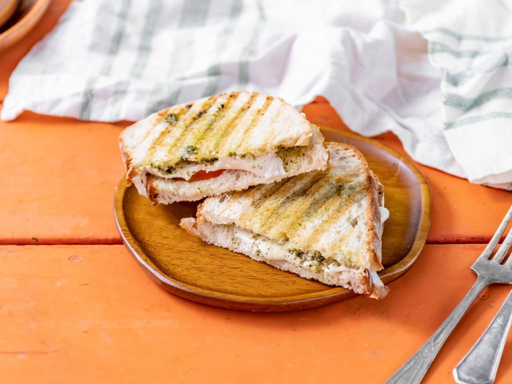 Grilled Cheese · Rustic White bread loaded with cheddar cheese. Grilled to perfection on a panini press.