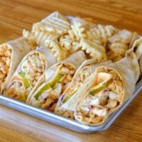 Hot Chicken Wrap · Sauteed chicken, Howdy slaw, sweet pickles, queso cheese and Howdy sauce in tortilla.