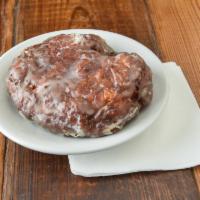 Apple Fritter Donut · Soft, but crunchy fritter-batter, made with pieces of apple, fried & glazed to perfection.