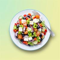 Greek OG Salad · Freshly sourced crisp iceberg lettuce, topped with feta cheese, black olives, cucumber, pars...