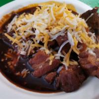Pozole Soup · Tender chunks of pork slow simmered in a peppery stock with hominy. Served with lime, cilant...