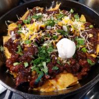 Chili Colorado Nachos · Spicy. Sammy's Chili Colorado on tortilla chips with melted cheese. Served with sour cream.
