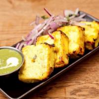 Pudina Paneer Tikka · Indian cottage cheese cubes, arranged on skewers and grilled in tandoor oven with mint.