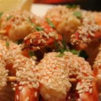 Shrimp Til Tinka · Array of shrimps coated with sesame seed and spicy Goan sauce.