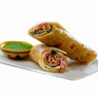 Sheekh Kabab Roll · 2 Minced chicken kababs wrapped in a naan with lettuce, tomato, onions, and chutney.