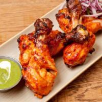 Tangri Kabab · Drumsticks marinated in tandoori masala and cooked in clay oven. 