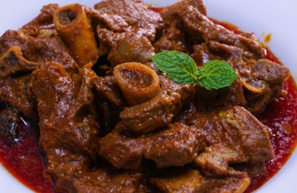 Agra Goat Masala · Juicy and tender goat meat sauteed slowly with special spices. Served with portion of Basmati rice.