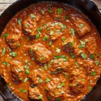 Lamb Curry · Lamb cooked in traditional sauce with freshly grounded spices. Served with portion of Basmat...