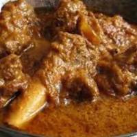 Balti Gosht · Slow cooked goat on the bones with tomato and garam masala. Served with portion of Basmati r...