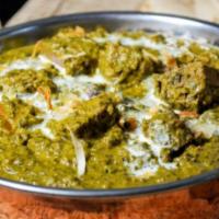 Lamb Saag · Tender pieces of lamb cooked with spinach and lentils. Served with portion of Basmati rice.