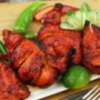 Saffron Tandoori Chicken · Half a Chicken in a masala yogurt marinade, grilled in our authentic clay oven. Served with ...