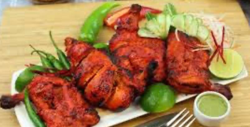Saffron Tandoori Chicken · Half a Chicken in a masala yogurt marinade, grilled in our authentic clay oven. Served with portion of Basmati rice.