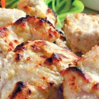 Chicken Malai Kabab  · Tender chicken breast marinated in cream cheese, garlic, ginger and coriander.
Served with a...