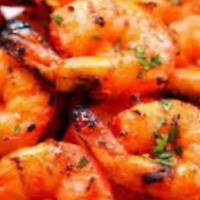 Tandoori Shrimp · Marinated shrimp cooked in tandoor and served with portion of Basmati rice.