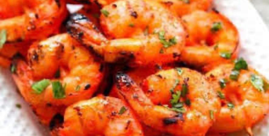 Tandoori Shrimp · Marinated shrimp cooked in tandoor and served with portion of Basmati rice.