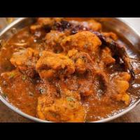Madras Chicken Chettinad · Boneless chicken cooked in authentic traditional curry sauce, a spicy treat. Served with por...