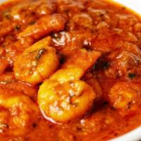 Garlic Shrimp Curry · Shrimp cooked in specially prepared herbs and spices with a touch of ginger and garlic. Serv...