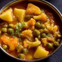 Aloo Gobi · Florets of cauliflower and potatoes cooked in a tomato and ginger flavored masala. Served wi...