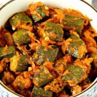 Bhindi Masala · Green okra, stir fried in light spices with onions and capsicums. Served with portion of ric...