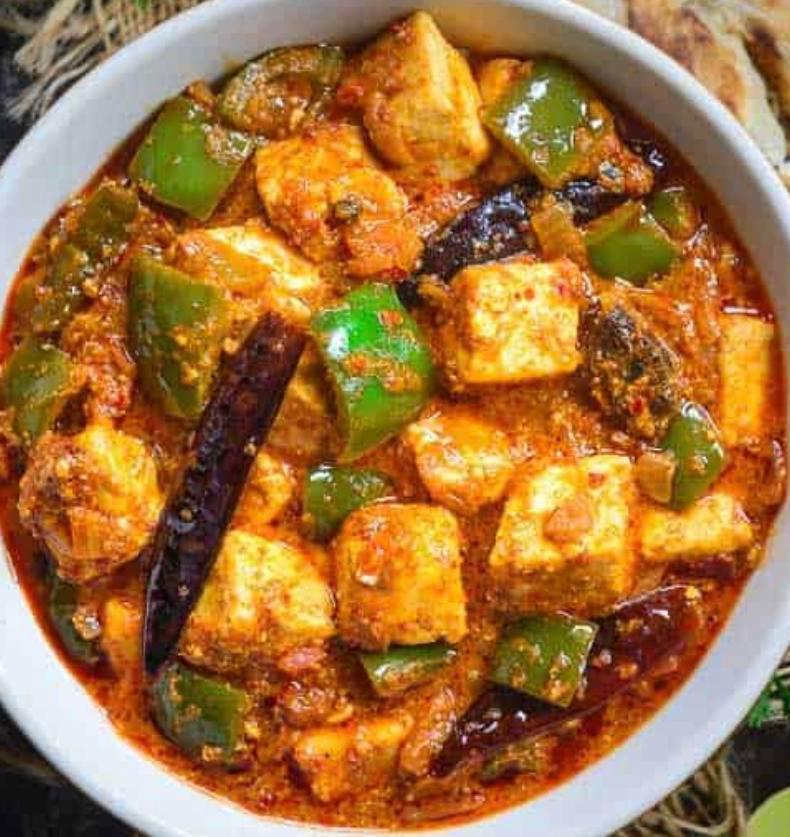 Kadai Paneer · Indian cottage cheese in a thick curry sauce with freshly pounded spices. Served with portion of rice.