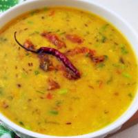 Dal Balti · Yellow lentil dish with garlic, cumin seed, whole red chilies and cilantro.