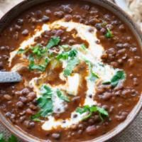 Dal Makhani · Black lentils very slowly cooked with tomatoes and ginger.