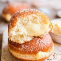Bomboloni Custard Cream with Small Homemade Gelato · A soft fluffy fried dough filled with a velvety pastry cream and rolled in sugar.