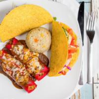 Plato Guzman · Ground beef enchilada, shredded chicken enchilada covered in chili gravy. A crispy ground be...