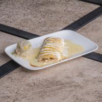 Burrito con Queso Blanco · Flour tortilla stuffed with ground beef smothered with Queso Blanco and grated cheese. Serve...