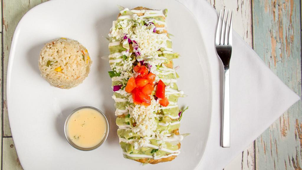 Chimi and Changa · Flour tortilla filled with shredded chicken, cheese, and crisped to perfection. Dressed in lettuce, tomatoes, sour cream, guacamole, and Queso Blanco. Served with Aguirre's rice. Served with Aguirre's rice.
