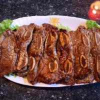 La Galbi 烤牛仔骨 · Marinated beef ribs in a special house sauce, come with 2 Banchan, 1 Bowl of White Rice, 1 G...
