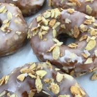 Rosewater Almond Glazed Doughnut · A hearty, large yeast doughnut cooked to perfection and covered in a light rosewater glaze, ...