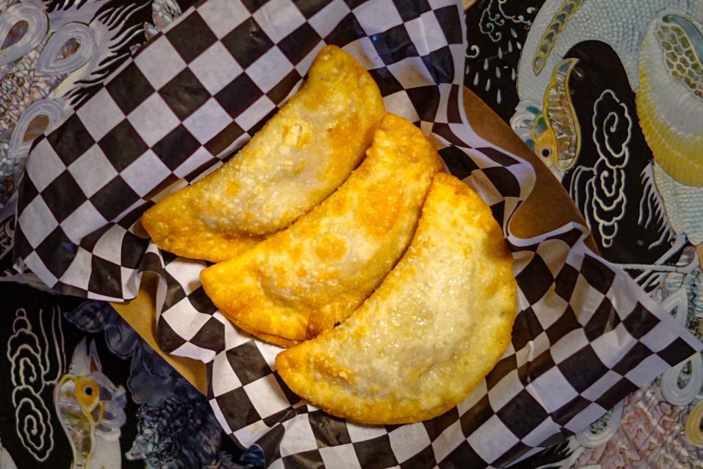 Pork Fried Dumplings · Pork and vegetable encased in a wheat flour dough and served with a side of sweet chili sauce.