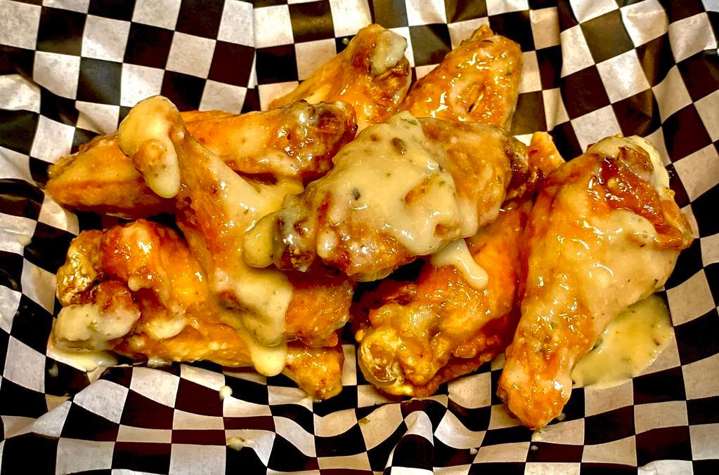 Garlic Parmesan Wings · Deep fried and smothered in our version of  garlic parmesan sauce. 