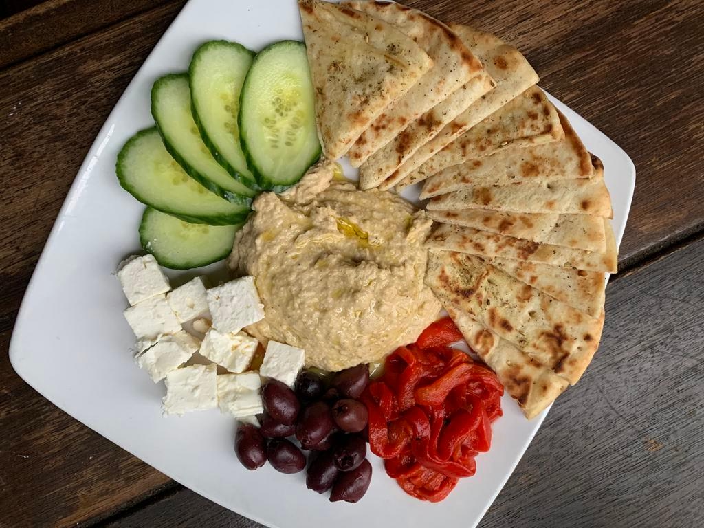 Garlic Hummus Platter  · Hose Made Garlic Hummus, Pita, Fets, Cucumbers, Olives, Roasted Red Peppers, Olive Oil 