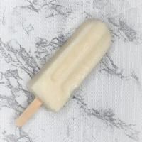 Coconut Paletas · Smooth and sweet coconut cream with coconut flakes.

