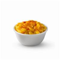 Baked Mac & Cheese · We take mac & cheese, sprinkle shredded cheddar cheese on top, then bake it to golden perfec...